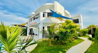 A vendre une magnifique Villa R+2  à SAly Carrefour – Piscine, Jardin & Studios